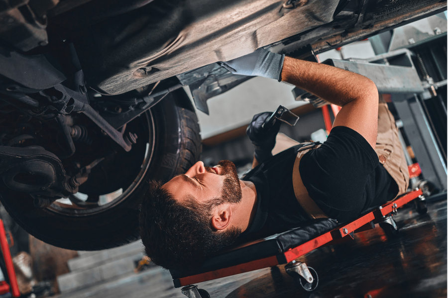 Male-Technician-Working-on-Car.jpeg