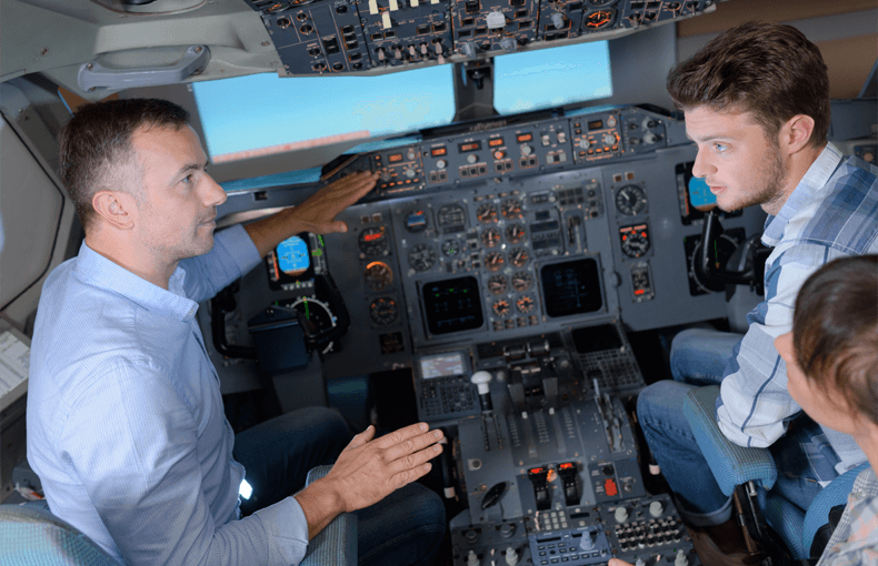 Pilot instructing in plane