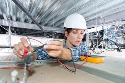 Electrician Working with a Multimeter